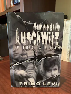 A book cover with a black and white photo showing children