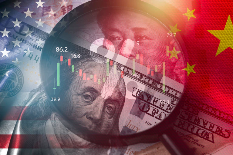 us and china banknotes superimposed with their national flags