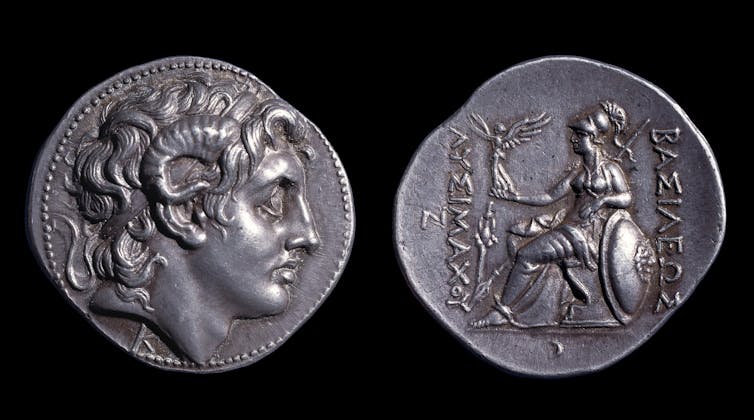 A silver coin, front and back.