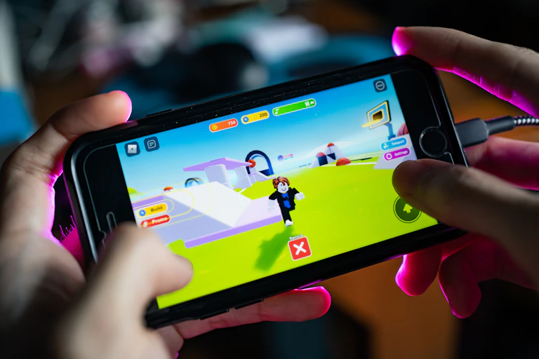 Person playing interactive game on their mobile phone.