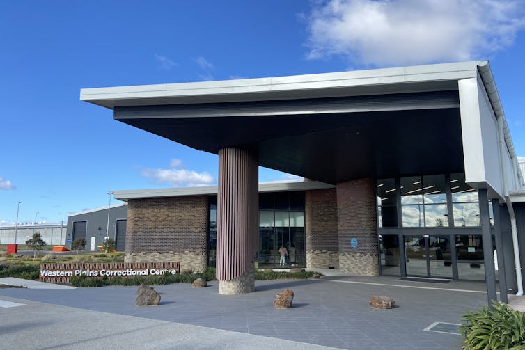 The exterior of a modern brick and concrete building