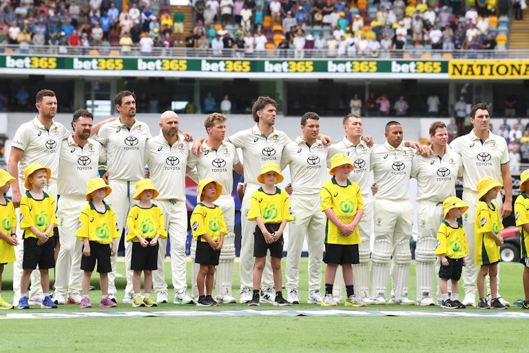 The Australian mens cricket team stand for the anthem.