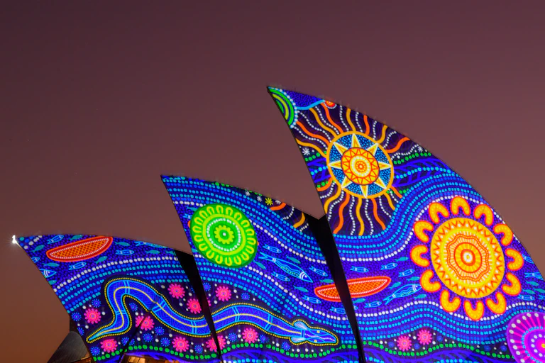 Colorful circles projected onto the sails of the Sydney Opera House.