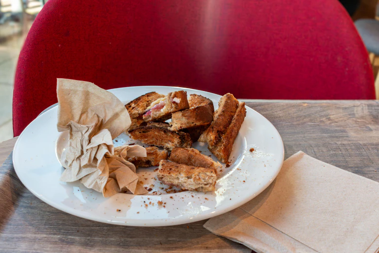 Bread crusts sitting on a plate.