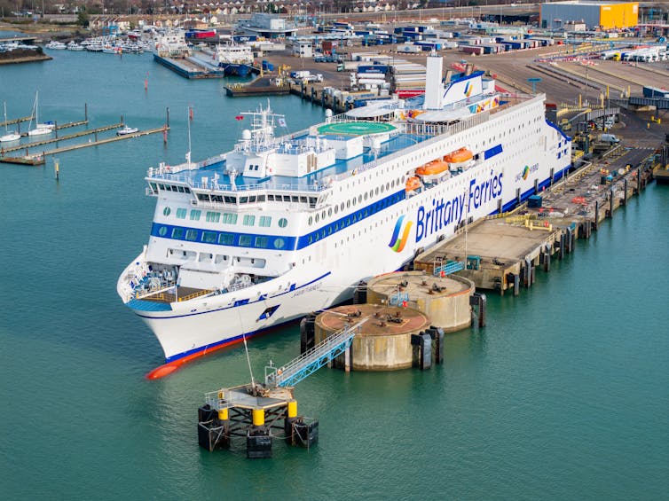 big ferry moored at berth, charging up