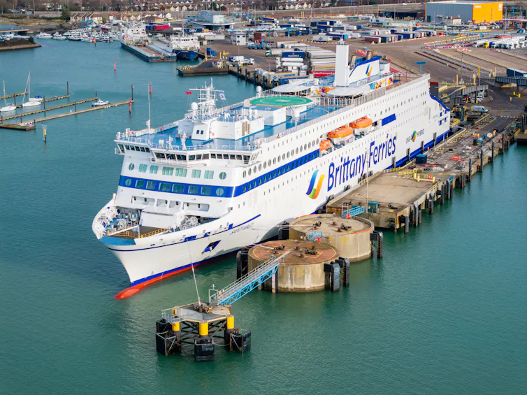 big ferry moored at berth, charging up