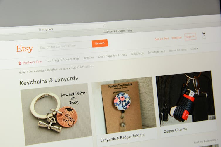 Etsy website on laptop screen. Etsy logo