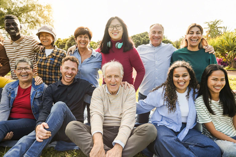 A group of people or varying ages in an outdoor setting