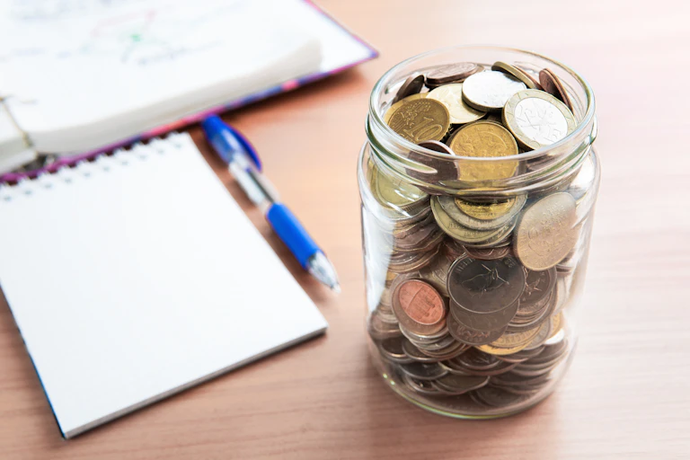Coins in a glass jar.