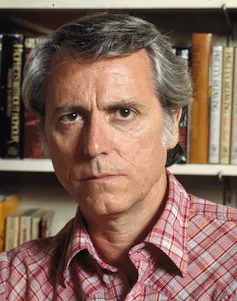 Don DeLillo photographed in front of a book shelf