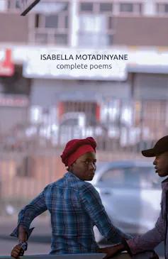 A book cover that is a photo of a young African woman with a young man, she turns her head to glare at the camera.