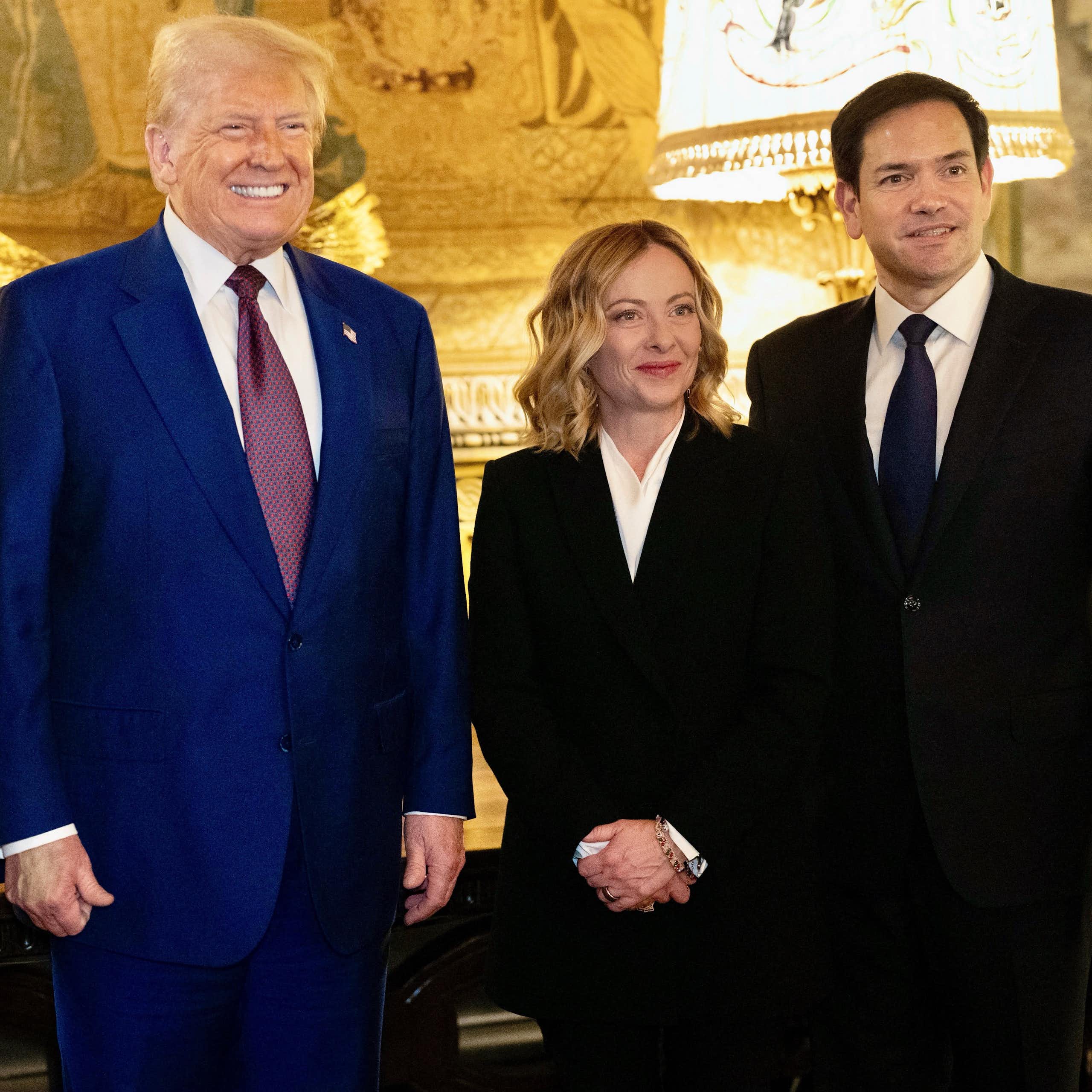 US national security adviser Mike Waltz, US president Donald Trump, Italian prime minister Giorgia Meloni and US Senator Marco Rubio are seen standing in a brightly lit room.