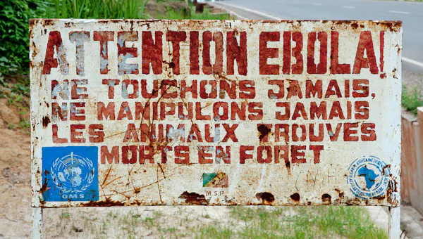 Old sign in French warning about Ebola