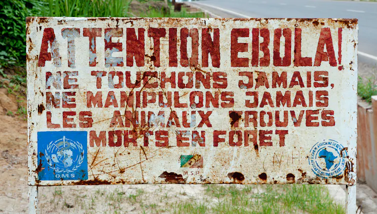 Old sign in French warning about Ebola