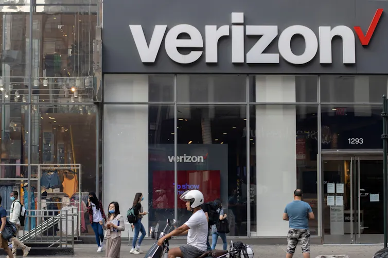 Street view of a building with big verizon logo in New York.