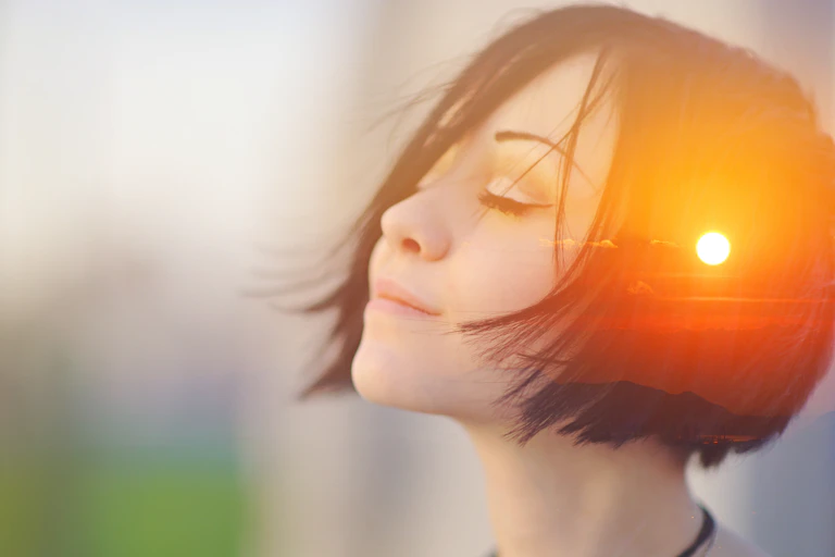 A person with a sunrise seen in their mind.