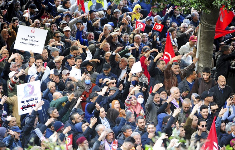 A crowd gathers at a protest.