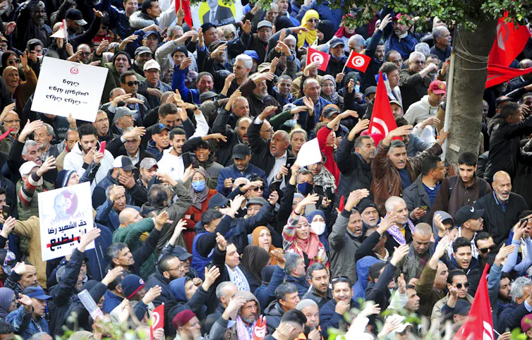 A crowd gathers at a protest.