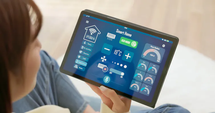 woman looks at tablet screen