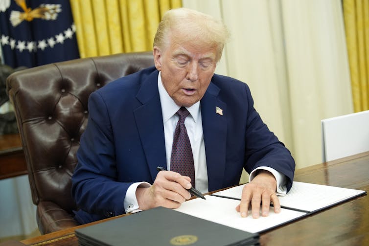 President Trump signs executive order in Oval Office