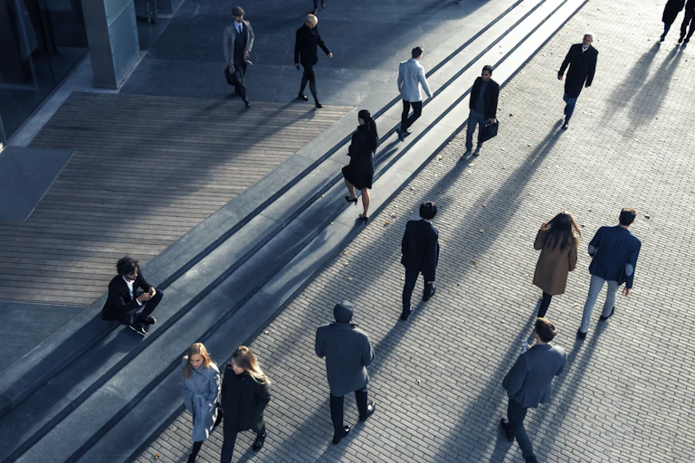 Business people seen from above commuting to work in the morning