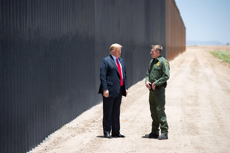 Donald Trump visiting the US-Mexico border wall.