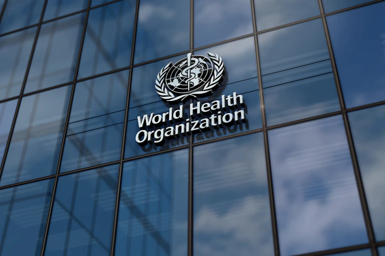 The World Health Organization logo on the outside of its headquarters.