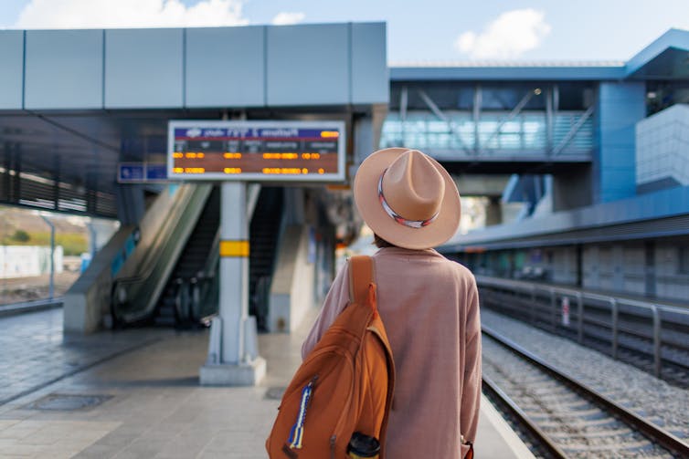 Woman waiting for a train