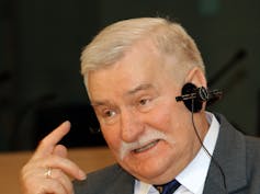 A man wearing an audio device.