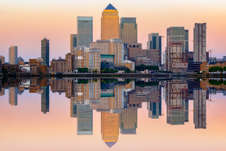 Canary Wharf with pink sky.