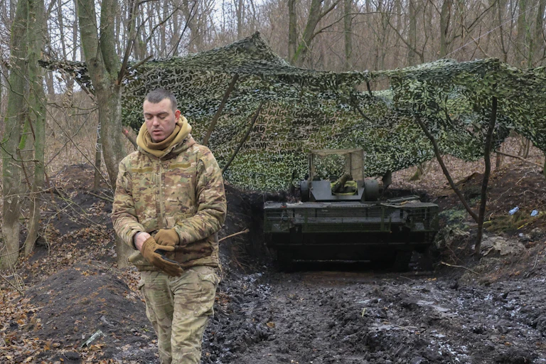 A Ukrainian soldier on exercises with a tank in the Kharviv region