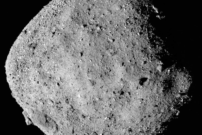 A photo of an asteroid with a rocky, dusty surface.