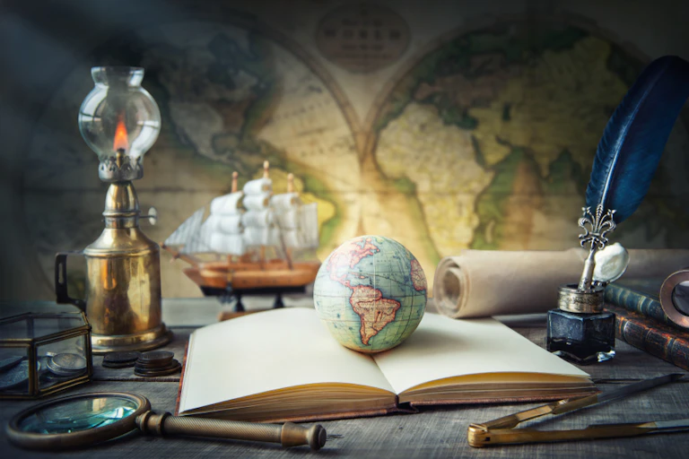 Globe, télescope, livre, atlas.