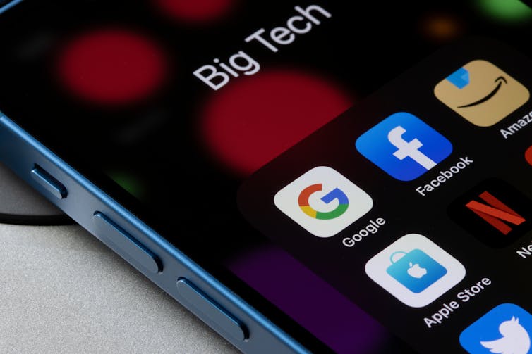 Assorted app icons representing some of the major big tech companies in the US, including Alphabet, Meta, Amazon, Apple, Netflix, and Twitter