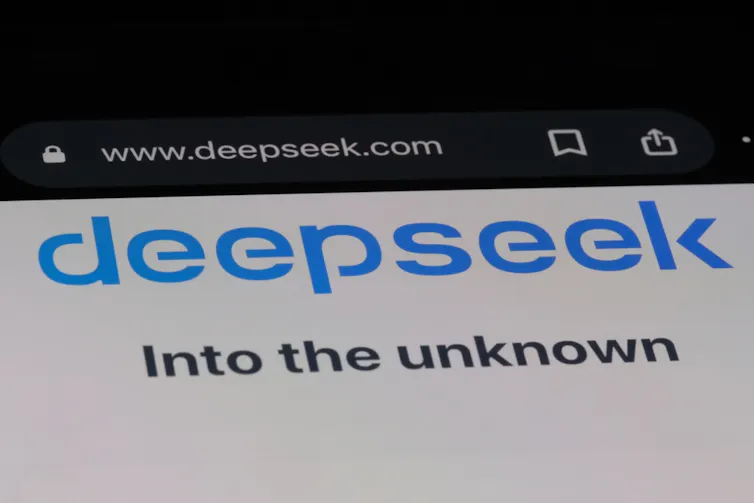 Computer screen with deepseek logo and the words into the unknown underneath it.