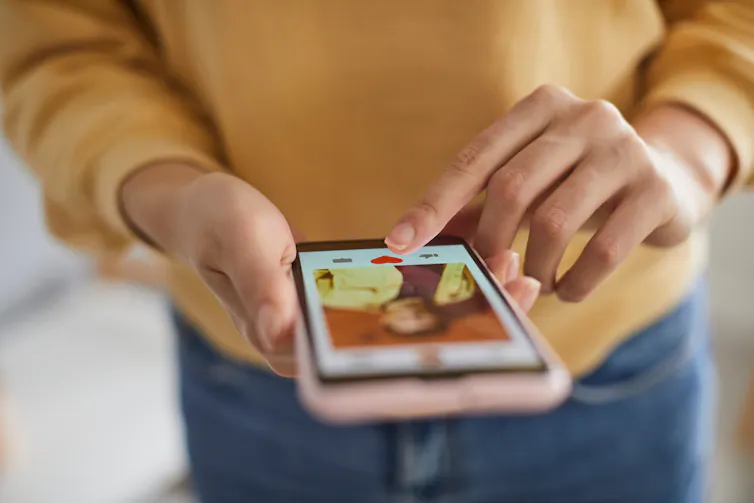 A woman using a dating app.