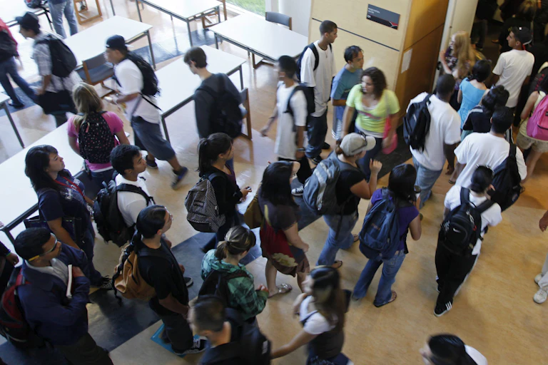 Students entering a lecture hall.
