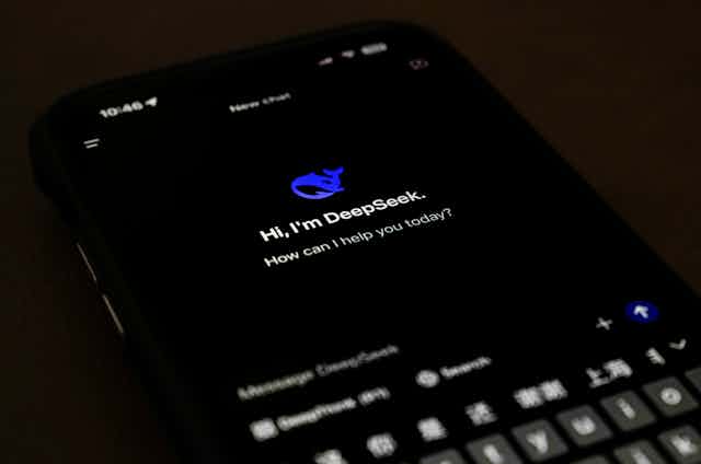 a smartphone screen showing text and a small icon of a blue whale