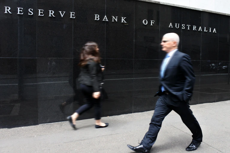 Man walking past bank