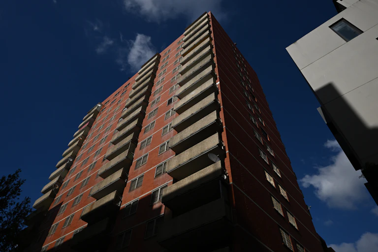 Looking up at a to be demolished during an announcement at the Nicholson and Elgin Street Public Housing Towers at Carlton in Melbourne.