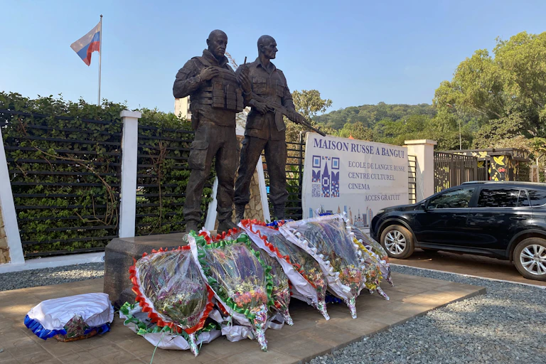 Wreaths laid at the foot of a statue