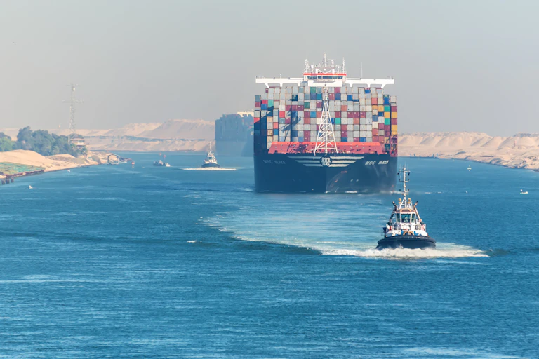A large container ship passing through the Suez Canal.