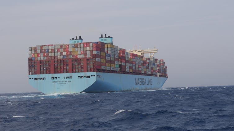 A Maersk container ship sailing through the ocean.