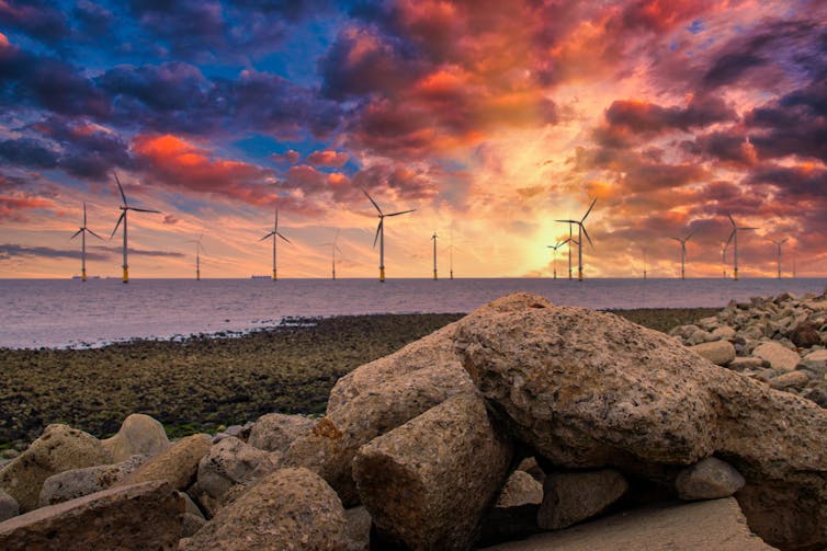 Offshore wind farm at sunset,