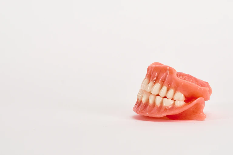A set of dentures against a white background.
