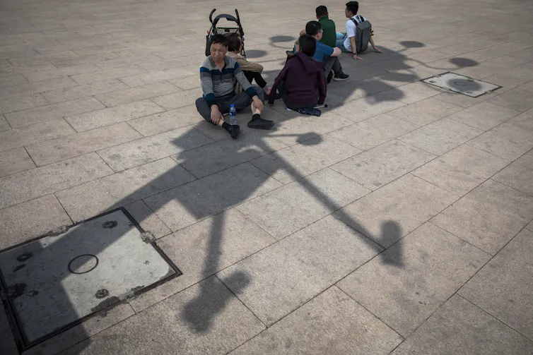 Shadows on a pavement.