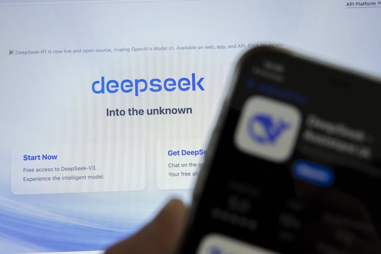 Mobile phone and computer screen displaying the DeepSeek logo.