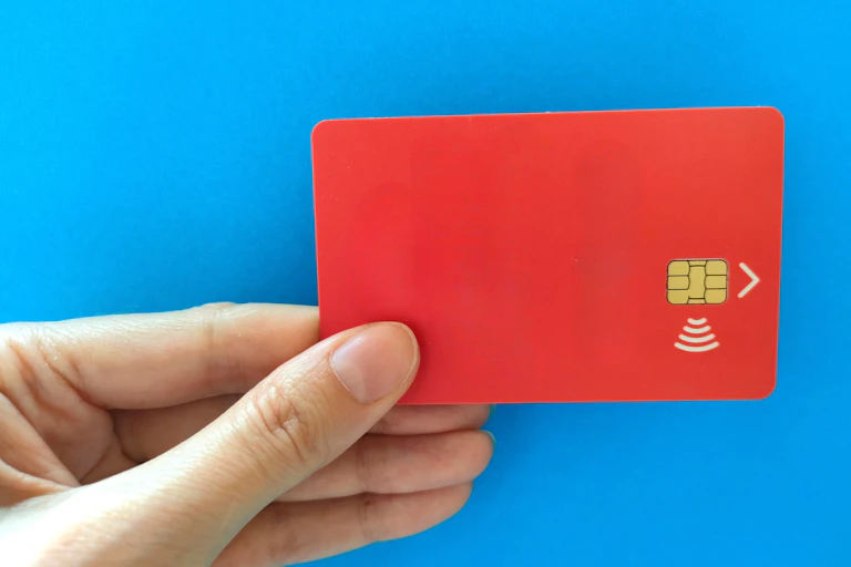 Hand holding a numberless credit card