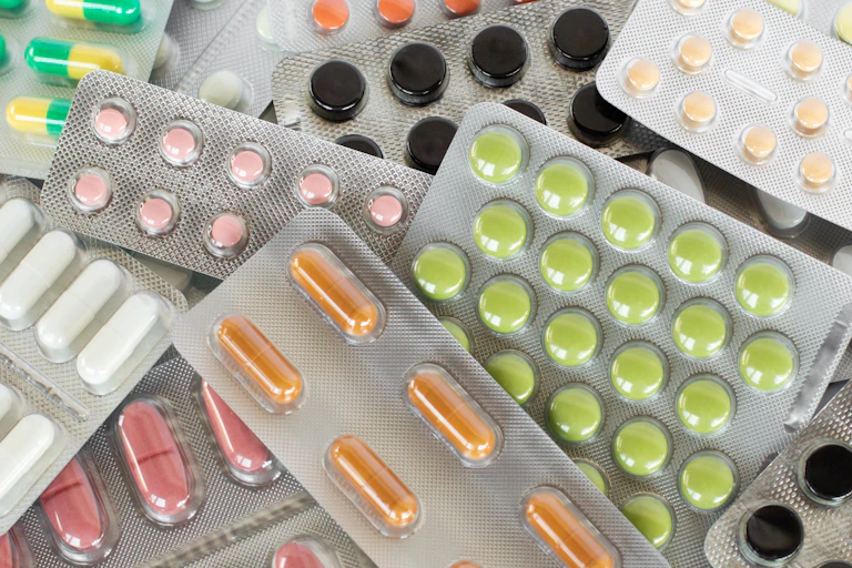 Multiple blister packs of different prescription drugs.