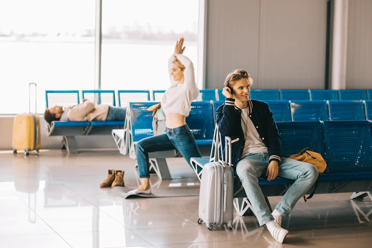 woman practicing yoga while waiting flight in airport terminal